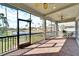 Spacious screened balcony with lake and community views at 1308 Alhambra Dr, Apollo Beach, FL 33572