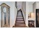 Dark wood staircase with a traditional design at 1308 Alhambra Dr, Apollo Beach, FL 33572