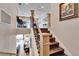 Open staircase with wood and wrought iron details at 1308 Alhambra Dr, Apollo Beach, FL 33572