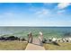 Private waterfront access with wooden steps leading to the water at 1308 Alhambra Dr, Apollo Beach, FL 33572