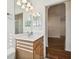 Bathroom with light wood vanity and single sink at 14608 Mirasol Manor Ct, Tampa, FL 33626