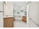 Bathroom boasts a large soaking tub, walk-in shower, and double vanity at 14608 Mirasol Manor Ct, Tampa, FL 33626
