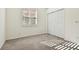 Simple bedroom with carpet flooring and double door closet at 14608 Mirasol Manor Ct, Tampa, FL 33626