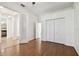 Hardwood floor bedroom with French doors and closet at 14608 Mirasol Manor Ct, Tampa, FL 33626