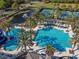 Resort-style pool with a water slide and tennis courts at 14608 Mirasol Manor Ct, Tampa, FL 33626