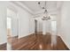 Spacious dining area with hardwood floors, leading to other rooms at 14608 Mirasol Manor Ct, Tampa, FL 33626