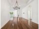 Bright dining room with hardwood floors and elegant chandelier at 14608 Mirasol Manor Ct, Tampa, FL 33626
