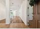 Bright entryway with wood floors and view to living room at 14608 Mirasol Manor Ct, Tampa, FL 33626