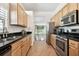 Bright kitchen with stainless steel appliances and granite countertops at 14608 Mirasol Manor Ct, Tampa, FL 33626