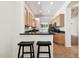 Kitchen features a breakfast bar with two black stools at 14608 Mirasol Manor Ct, Tampa, FL 33626