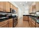 Modern kitchen featuring stainless steel appliances and granite counters at 14608 Mirasol Manor Ct, Tampa, FL 33626