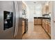 Kitchen with stainless steel appliances and light wood cabinets at 14608 Mirasol Manor Ct, Tampa, FL 33626