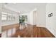 Living room with hardwood floors and sliding glass doors to patio at 14608 Mirasol Manor Ct, Tampa, FL 33626