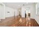 Open concept living room with kitchen views and hardwood floors at 14608 Mirasol Manor Ct, Tampa, FL 33626