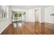 Living area featuring hardwood floors and access to a patio at 14608 Mirasol Manor Ct, Tampa, FL 33626