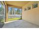 Spacious screened patio with concrete flooring, offering a relaxing outdoor space at 14608 Mirasol Manor Ct, Tampa, FL 33626