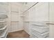 Large walk-in closet with ample shelving and drawers at 14608 Mirasol Manor Ct, Tampa, FL 33626
