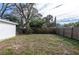 Fenced backyard with mature trees at 1575 S Martin Luther King Jr Ave, Clearwater, FL 33756