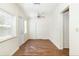 Bedroom with wood floors, door and window at 1575 S Martin Luther King Jr Ave, Clearwater, FL 33756