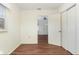 Bedroom featuring hardwood floors and access to other rooms at 1575 S Martin Luther King Jr Ave, Clearwater, FL 33756