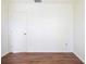 Empty bedroom with wood floors and door at 1575 S Martin Luther King Jr Ave, Clearwater, FL 33756