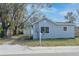 Gray house with a detached garage, and a small front yard at 1575 S Martin Luther King Jr Ave, Clearwater, FL 33756