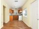 Kitchen with wood cabinets and laminate floor at 1575 S Martin Luther King Jr Ave, Clearwater, FL 33756