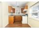 Small kitchen, wood cabinets, laminate floor at 1575 S Martin Luther King Jr Ave, Clearwater, FL 33756