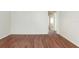 Living room with hardwood floors and access to other rooms at 1575 S Martin Luther King Jr Ave, Clearwater, FL 33756