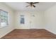 Living room featuring hardwood floors, neutral walls and a ceiling fan at 1575 S Martin Luther King Jr Ave, Clearwater, FL 33756