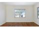 Spacious living room with hardwood floors and large windows at 1575 S Martin Luther King Jr Ave, Clearwater, FL 33756