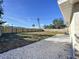 Large backyard with gravel and wooden fence at 1709 Marilyn Ave, Bradenton, FL 34207