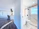 Modern bathroom with marble tile, shower, and a vanity with sink at 1709 Marilyn Ave, Bradenton, FL 34207