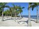 Relaxing beach area with lounge chairs and palm trees at 1709 Marilyn Ave, Bradenton, FL 34207