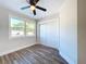 Spacious bedroom with large closet and wood-look floors at 1709 Marilyn Ave, Bradenton, FL 34207
