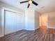 Spacious bedroom with double-door closet and wood-look floors at 1709 Marilyn Ave, Bradenton, FL 34207