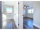 Two bright bedrooms with wood-look floors and ceiling fans at 1709 Marilyn Ave, Bradenton, FL 34207