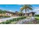 Community entrance with covered walkway and landscaping at 1709 Marilyn Ave, Bradenton, FL 34207