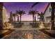 Outdoor patio area with tables and chairs at sunset at 1709 Marilyn Ave, Bradenton, FL 34207