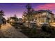 Evening view of the community streetscape with shops and parking at 1709 Marilyn Ave, Bradenton, FL 34207