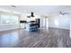 Open floor plan with hardwood floors and kitchen island at 1709 Marilyn Ave, Bradenton, FL 34207