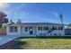 Newly renovated single story home with modern facade, new landscaping, and driveway at 1709 Marilyn Ave, Bradenton, FL 34207