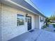 Updated front entry with a stylish black door and contemporary brick exterior at 1709 Marilyn Ave, Bradenton, FL 34207