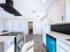Updated kitchen boasts stainless steel appliances and a stylish backsplash at 1709 Marilyn Ave, Bradenton, FL 34207