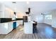 Modern kitchen with white cabinets, stainless steel appliances, and island at 1709 Marilyn Ave, Bradenton, FL 34207