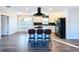 Open kitchen with island and stainless steel appliances at 1709 Marilyn Ave, Bradenton, FL 34207