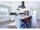 Modern kitchen with white cabinets, quartz countertops, and an island at 1709 Marilyn Ave, Bradenton, FL 34207