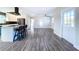 Spacious living area with hardwood floors and access to kitchen at 1709 Marilyn Ave, Bradenton, FL 34207