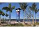 Riverwalk entrance with palm trees and bridge view at 1709 Marilyn Ave, Bradenton, FL 34207