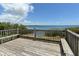 Wooden deck overlooking calm water with benches and railings at 1709 Marilyn Ave, Bradenton, FL 34207